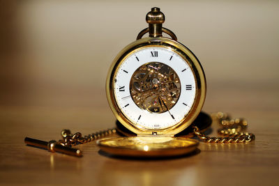 Close-up of clock on table