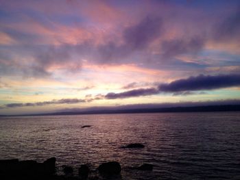 Scenic view of sea against cloudy sky