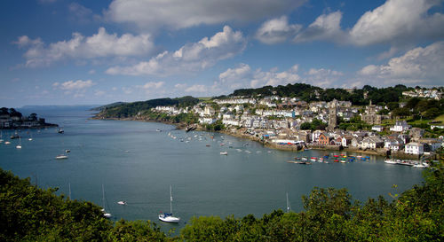High angle view of boats moored in sea against sky