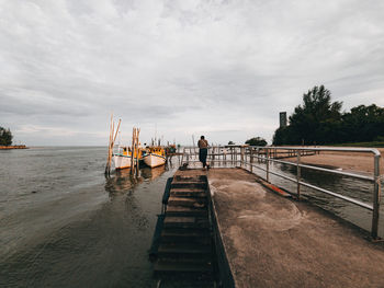 Pier over sea against sky