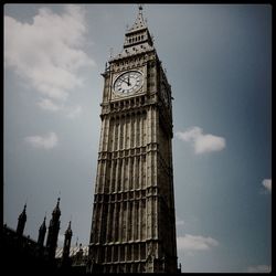 Low angle view of clock tower against sky