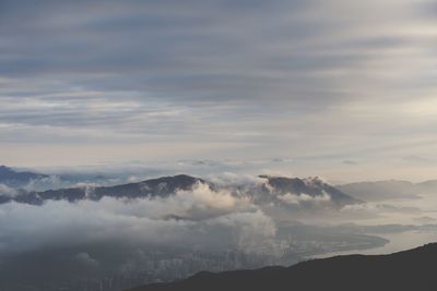 Scenic view of mountains against cloudy sky