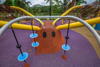 Multi colored swing hanging in park