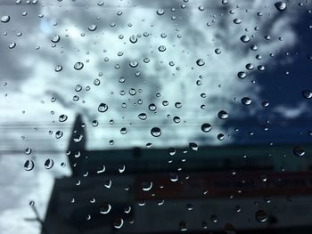 Full frame shot of raindrops on window