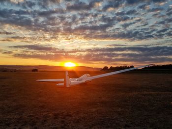 Scenic view of sunset over land