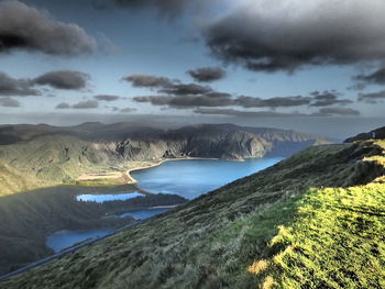 Scenic view of mountains against cloudy sky