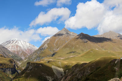 View of mountain range against cloudy sky