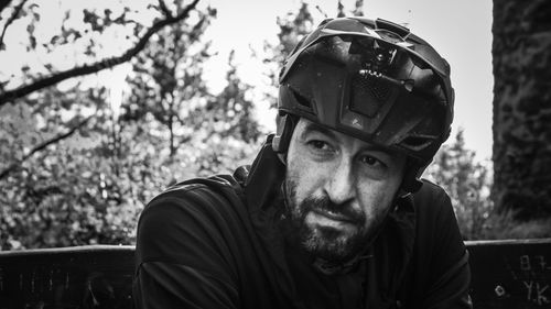 Portrait of man wearing sunglasses against trees