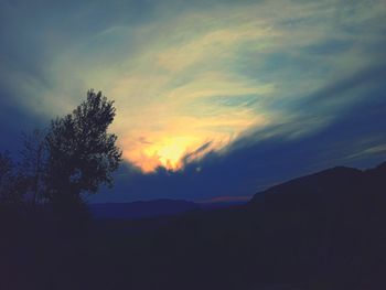 Scenic view of silhouette mountain against sky during sunset
