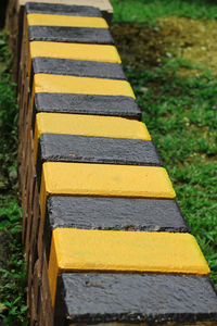 High angle view of yellow stones on grass