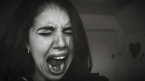 Close-up of young woman with eyes closed