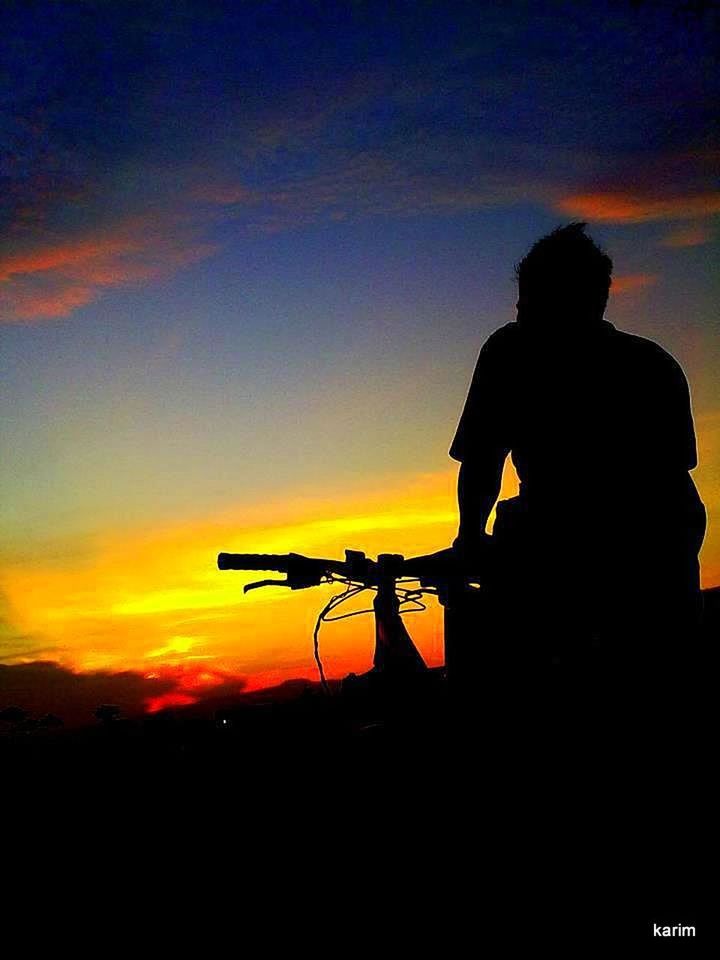 silhouette, sunset, sky, orange color, lifestyles, leisure activity, men, beauty in nature, scenics, standing, nature, tranquility, tranquil scene, person, idyllic, cloud - sky, copy space