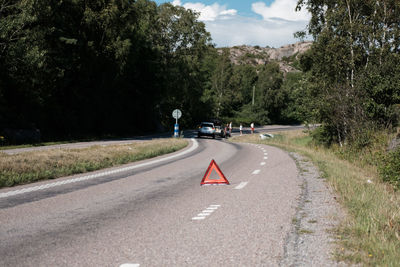 People standing by cars on road during accident