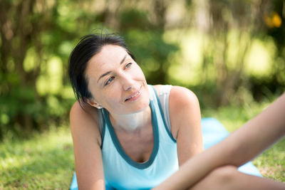 Close-up of woman with girl at park