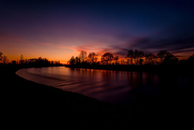 Flowing water at sunset po valley countryside italy