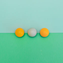 High angle view of eggs against blue background