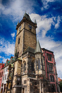 Low angle view of clock tower against sky