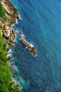 High angle view of rock formation in sea