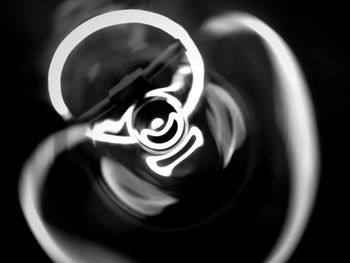 Close-up of tea cup against black background