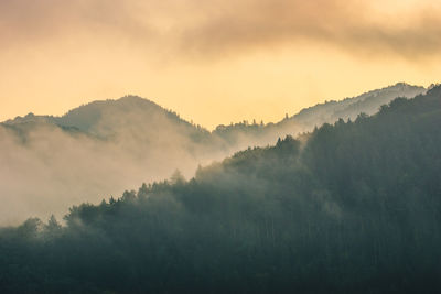 Scenic view of mountains against sky during sunset