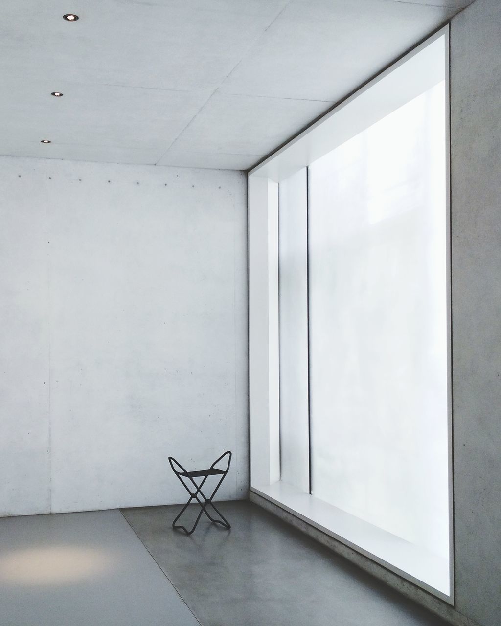 indoors, no people, wall - building feature, absence, white color, seat, architecture, window, chair, day, built structure, office, empty, glass - material, flooring, domestic room, museum, still life, table