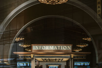 Low angle view of illuminated text on ceiling