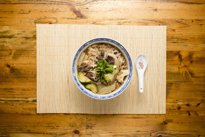 Directly above shot of soup served on table