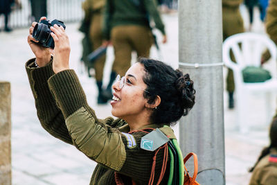 Portrait of young man photographing