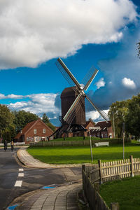 Traditional windmill against sky