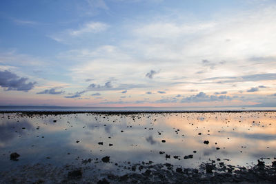 Reflection of sky on beach