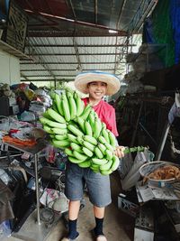 Cropped hand of woman standing in market