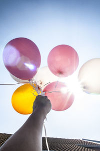 Woman holding balloons