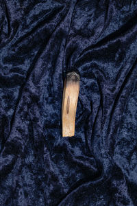 High angle view of camera on bed