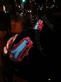 High angle view of woman standing on illuminated street