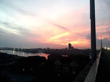 High angle view of buildings against sky at sunset