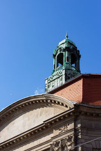 Low angle view of building against blue sky