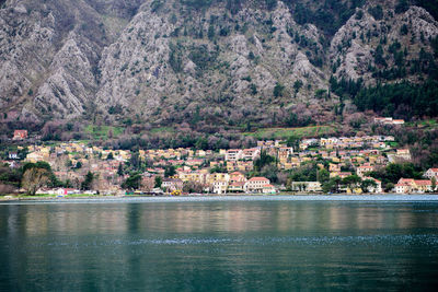 Scenic view of river by buildings in city