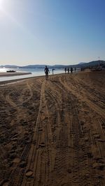 Man on beach against sky