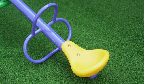 Close-up of seesaw on grass
