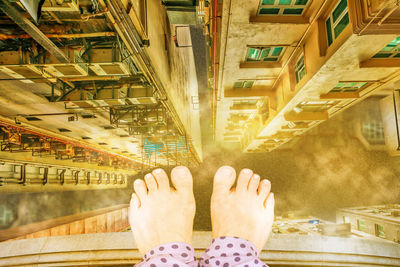 Low section of woman standing on building terrace