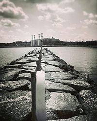 Scenic view of sea against cloudy sky