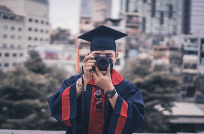 Portrait of man photographing camera