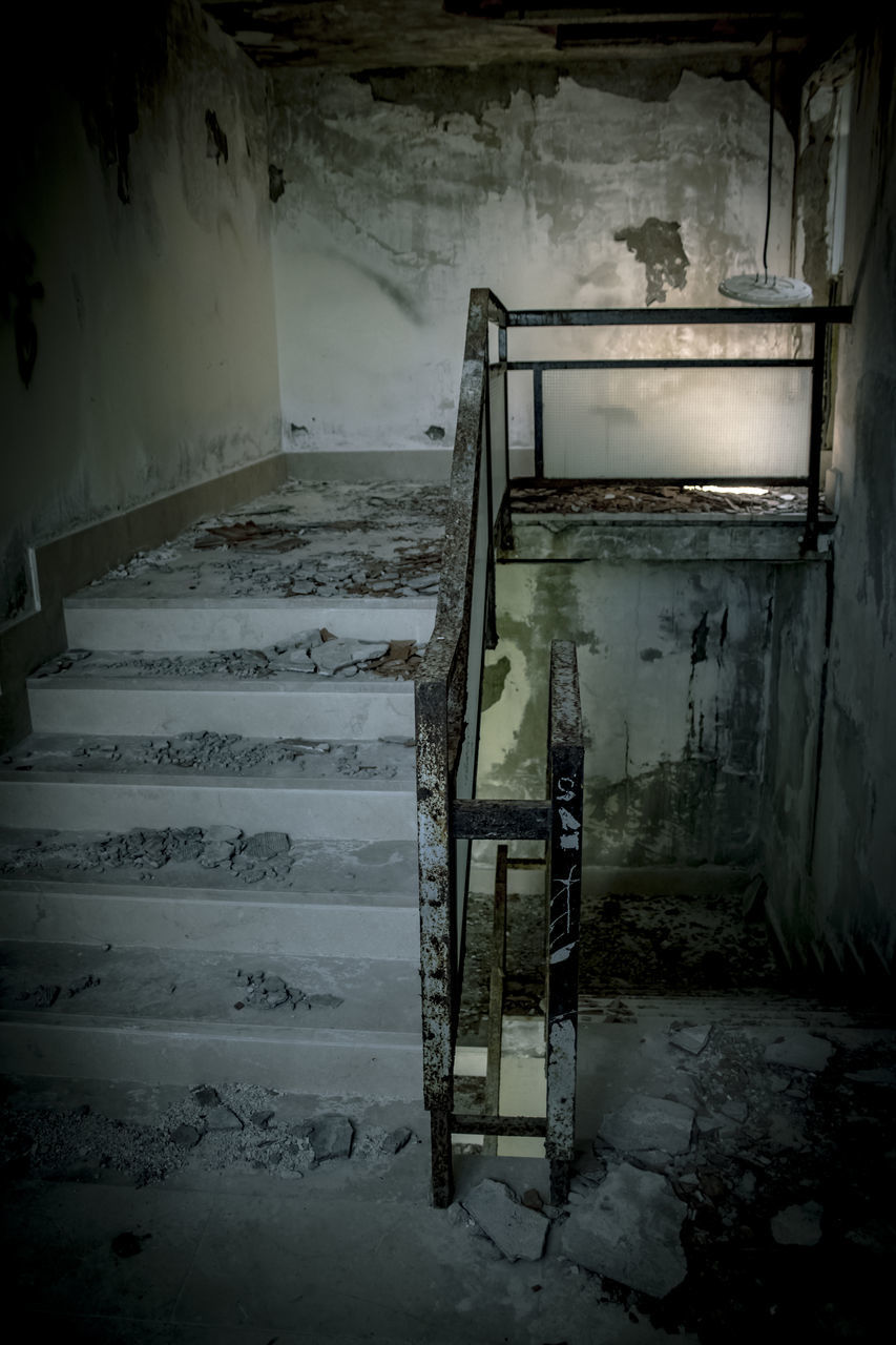 OLD STAIRCASE IN ABANDONED BUILDING