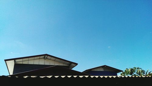 Low angle view of built structure against clear blue sky