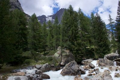 Scenic view of rocks in mountains against sky