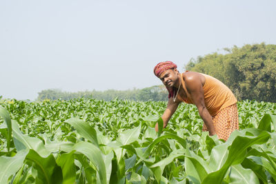 Side view of a man standing on field