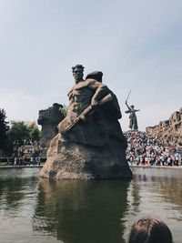 Statue with people in background