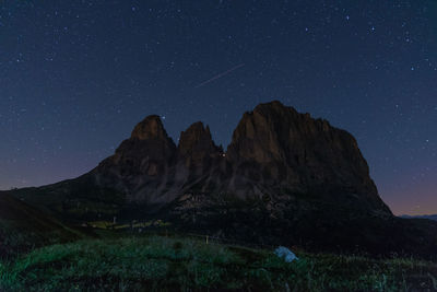 Scenic view of mountains against sky at night