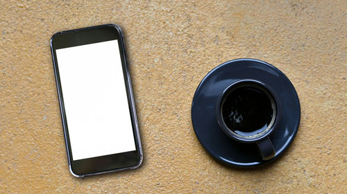 High angle view of coffee cup on table