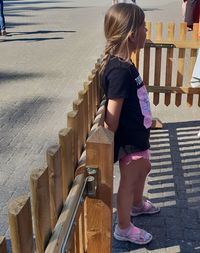 Full length of woman standing on staircase